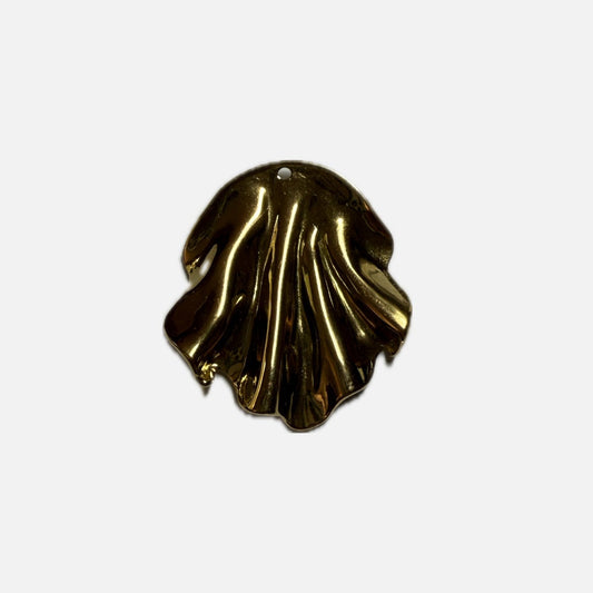 Gold shell-shaped object on a white background