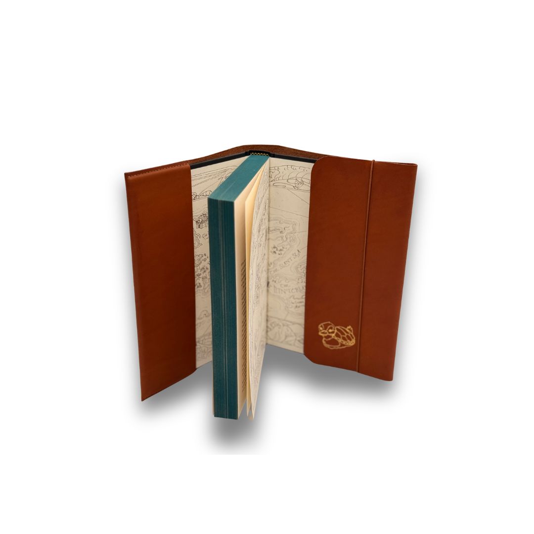 Brown leather-bound book with map design on a white background