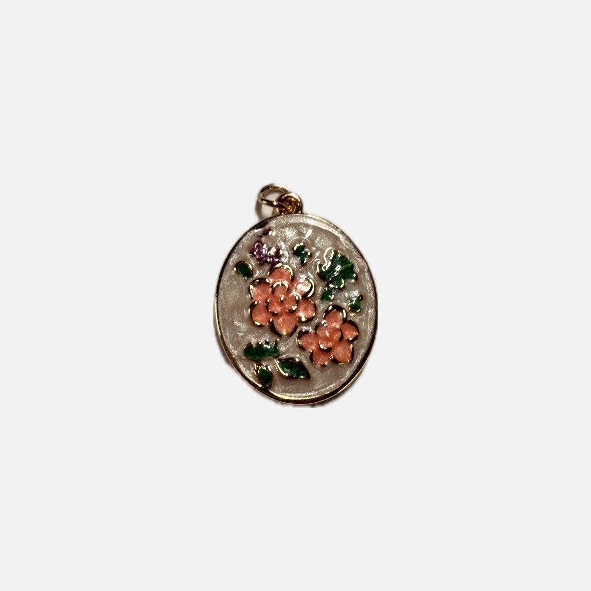 Decorative pendant with floral design on a white background