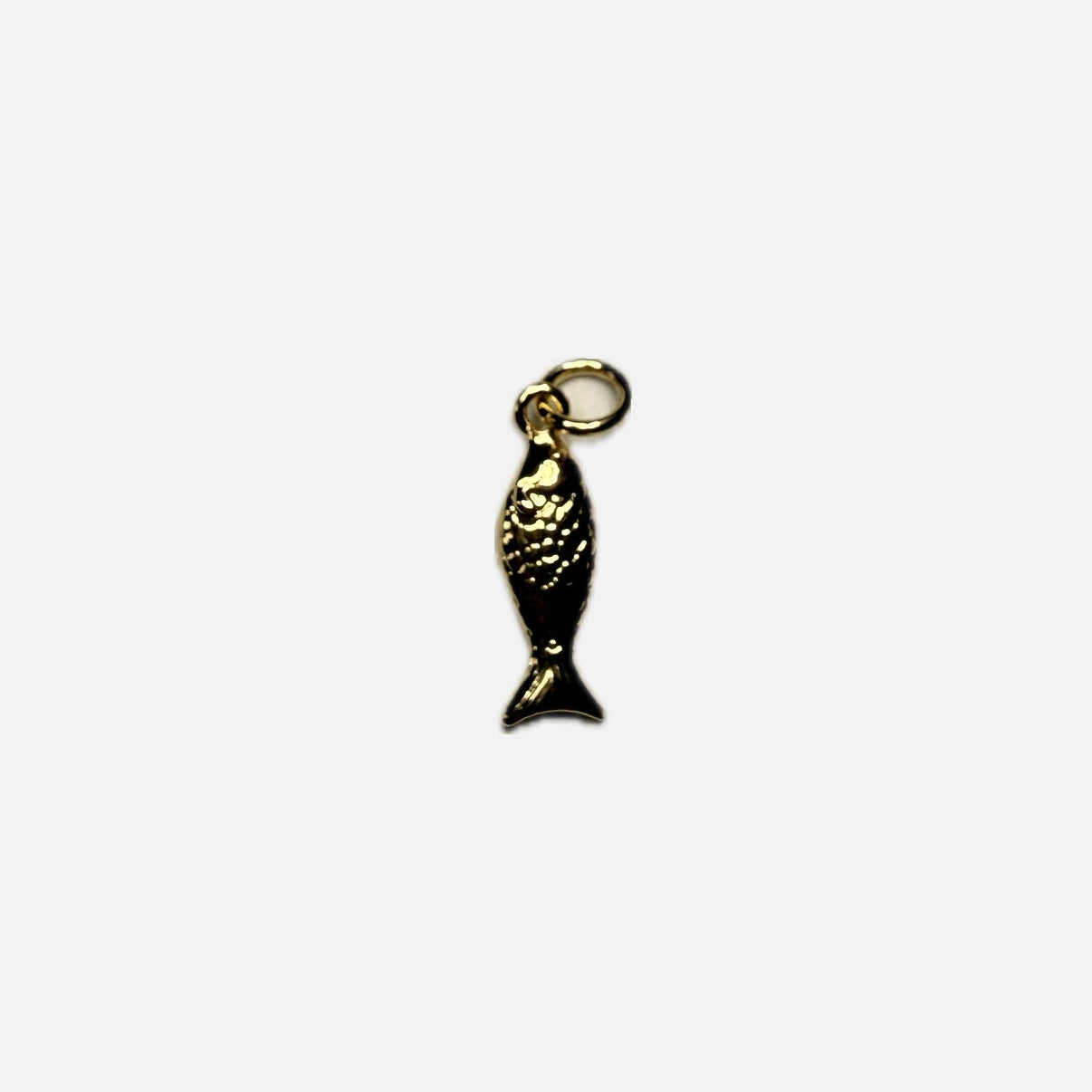 Gold fish pendant with a white background