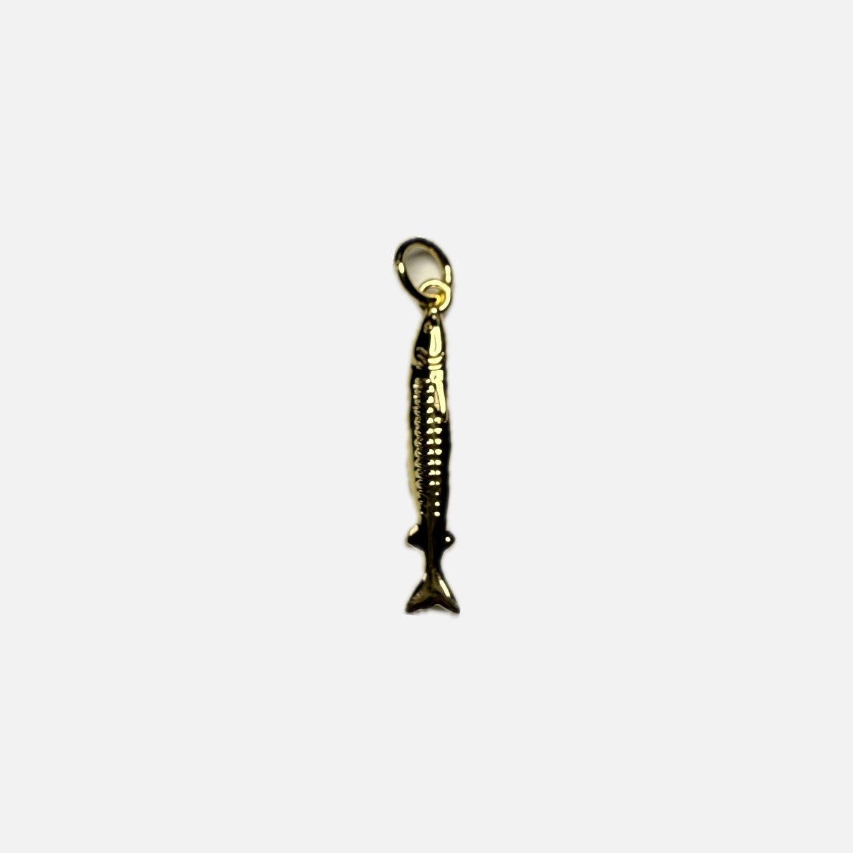 Gold long fish pendant on a white background