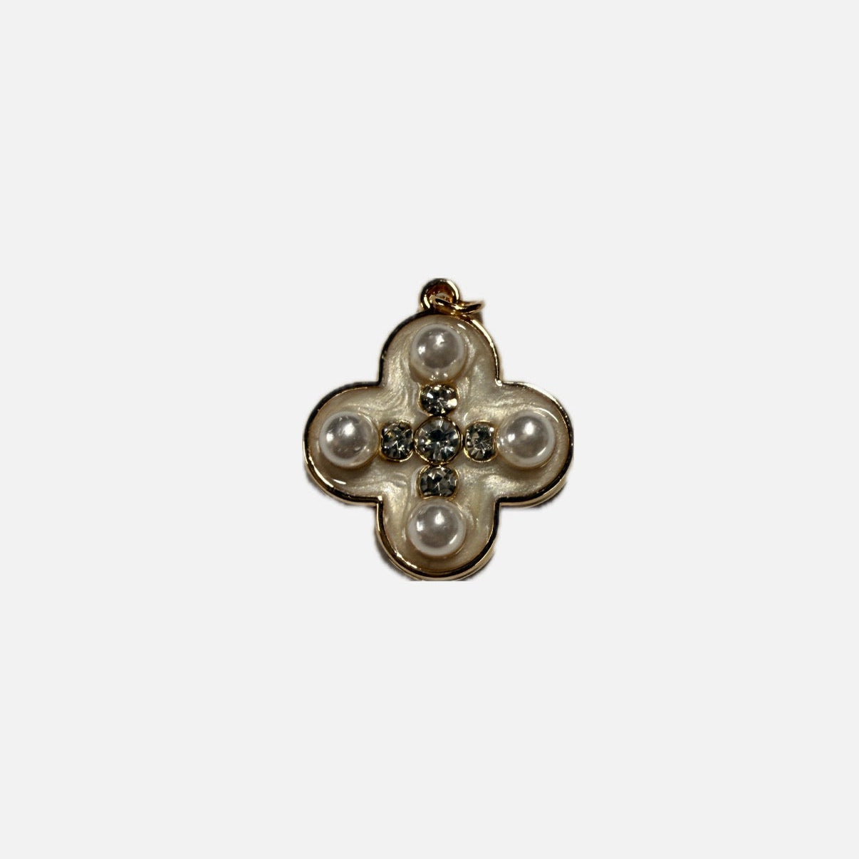 Decorative brooch with pearls and gemstones on a white background