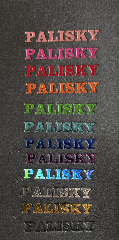 Repetition of the word 'PALISKY' in various colors on a dark background